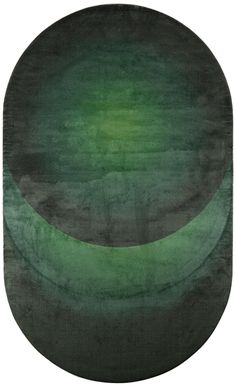 an oval rug with two green circles on the bottom and one black circle at the top