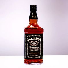 a bottle of jack daniels whiskey sitting on a table