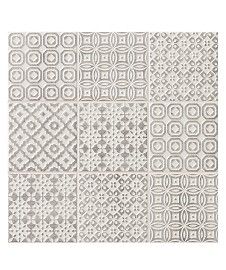 an area rug with different patterns on it, including squares and circles in grey tones