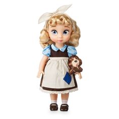 a doll with blonde hair and blue eyes holding a stuffed animal in her hand, on a white background