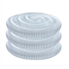 a white plastic hose is stacked on top of each other