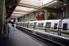 people are waiting for the train at the station