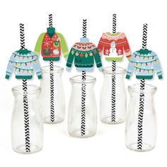 six glass jars with sweaters and drinking straws in front of each other on a white background