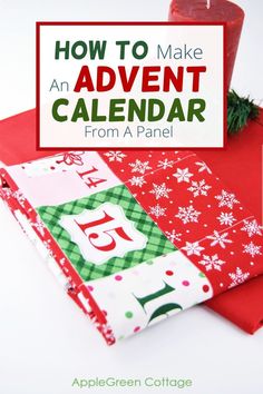 a red candle sitting on top of a pile of christmas wrapping paper with the words how to make an advent calendar from a panel