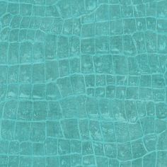 the texture of an alligator skin pattern in turquoise green