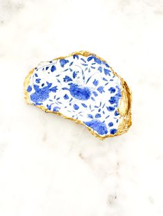 a blue and white plate sitting on top of a marble counter