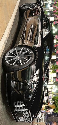 a row of parked cars sitting next to each other