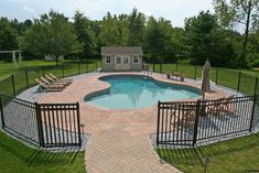 an above ground pool surrounded by lawn chairs