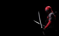 a man in a deadpool costume holding two swords