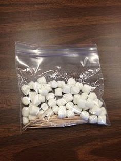 a bag of marshmallows sitting on top of a wooden table