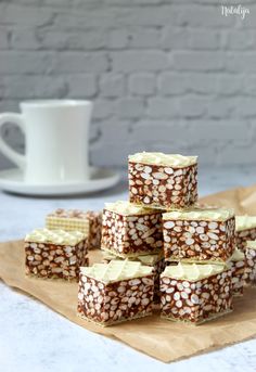 several pieces of cake sitting on top of a wooden cutting board