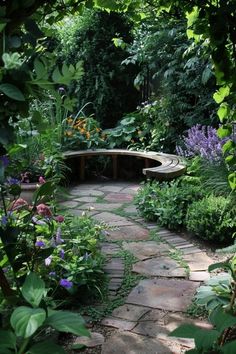 a stone path in the middle of a garden