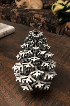 a christmas tree made out of snowflakes on a table