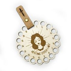 a wooden medal with a woman's face on it and the words missing stitchs