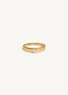 Inspired by Jennie's mother, Sun's vintage pleated ring, the Solis collection represents energy and strength. As an immigrant from South Korea in the 90's, Sun wore her ring as a reminder that she could make it through anything she set her mind to.Whether you're celebrating a commitment to a partner or a modern milestone, the Solis II is a timeless piece that you'll never take off.This ring is the smaller version of the Solis Ribbed Ring II.To add a custom engraving on the inside of the band, vi Fine Jewelry Wedding Rings With Fluted Bezel, Wedding Rings With Fluted Bezel, Timeless 14k Gold Rings With Fluted Bezel, Timeless 14k Gold Ring With Fluted Bezel, 14k Gold Rings With Fluted Bezel, 14k Gold Ring With Fluted Bezel, 14k Gold Promise Ring With Fluted Bezel, Timeless Jewelry With Fluted Bezel For Anniversary, Classic Rings With Fluted Bezel