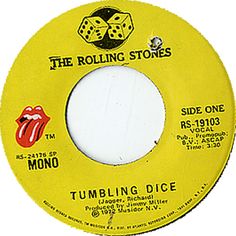 the rolling stones album,'tumbling dice'is shown on a yellow record