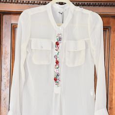 Beatrice B Embellished Long Sleeve Popover Blouse Size 40/4 Slip Over Style * Long Sleeves * Barrel Cuffs * Half Button Front * Embellished Front Detail * Spread Collar * 100% Viscose * Ivory Color * Front Chest Pockets Length From Collar To Bottom: 27" Underarm-To-Underarm: 18" Waist: 34" Hip: 38 Sleeves: 24" * New With Tags * Measurements Are All Taken With Garment Lying Flat And Outstretched Thank You, For Supporting My Small Business! Comes From Smoke Free Pet Free Home Ytbb14-26 Spring Long Sleeve Tops With Embellished Collar, Embellished Fitted Blouse For Work, Fitted Embellished Blouse For Work, Chic Embellished Blouse For Workwear, White Embellished Top For Work, Chic Spring Embellished Blouse, Embellished Summer Blouse For Work, Spring Embellished Long Sleeve Blouse, Feminine Embellished Spring Blouse