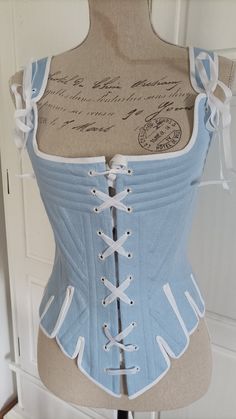 the corset is sewn from linen canvas, reinforced with metal bones, lined.  the edges of the corset are lined with white It has lacing on the front and back.  The holes are embroidered by hand. size 8 - bust 31"1/2, waist 24", hip 33"1/2 size 10 - bust 32"1/2, waist 25", hip 34"1/2 size 12 - bust 34", waist 26"1/2, hip 36" size 14 - bust 36", waist 28", hip 38" size 16 - bust 38", waist 30", hip 40" size 18 - bust 40", waist 32", hip 42" size 20 - bust 42", waist 34", hip 44" size 22 - bust 44", Light Blue Corset Top, Baroque Corset, 1890s Corset, Stays Pattern, Linen Corset, Medieval Hats, Pirate Dress, Sewing Jeans, Blue Corset