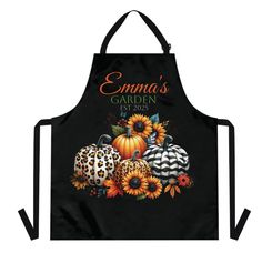 an apron with sunflowers and pumpkins on it that says enna's garden