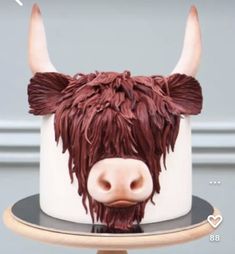 there is a cake with a cow head on it