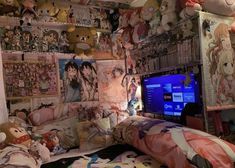 a bedroom with many stuffed animals on the wall and a television set in the corner