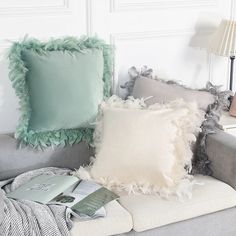 pillows and blankets on a couch in a living room