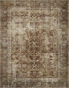 an antique rug with brown and beige colors