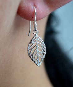 Sterling Silver 925 Open Leaf Hookwire Drop Earrings   Our silver products are solid sterling silver.  925 mark on the hook wire.   Total Weight: 1.4 g   The item comes with a gift pouch.    Measurements: Height: 3.1 cm Width: 1 cm Sterling Silver Leaf-shaped Jewelry With Ear Wire, Silver Sterling Silver Jewelry With French Hook, Minimalist Sterling Silver Leaf Jewelry, Minimalist Leaf-shaped Sterling Silver Jewelry, Sterling Silver Leaf Earrings With Ear Wire, Hypoallergenic Silver Leaf Jewelry, Silver Dainty Earrings With French Hook, Everyday Sterling Silver Leaf Jewelry, Second Piercing