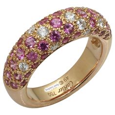 This gorgeous authentic ring the Étincelle de CARTIER collection is crafted in 18k rose gold and set with brilliant-cut round diamonds and round faceted pink sapphires. Made in France circa 2000s. Measurements: 0.23" (6mm) width. The ring size is 5 - EU 49. Non-resizable. Excellent condition. Comes with original box without paperwork. Luxury Cartier Round Band Jewelry, Cartier Collection, Cartier Diamond, Rose Gold Band Ring, Rose Gold Band, Gold Band Ring, Gold Band, Pink Sapphire, 18k Rose Gold