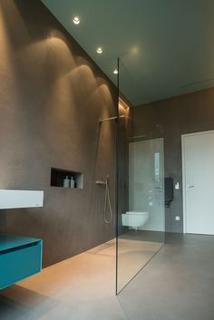 a bathroom with a glass shower and sink