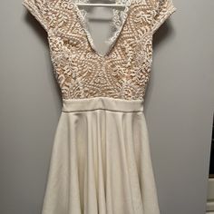 Cream Color Lace Dress Cream V-neck Mini Dress For Party, Cream Stretch Mini Dress, Beige Stretch Dress For Night Out, Beige Lace Trim Dress For Night Out, Spring Wedding Stretch Mini Dress, Beige Stretch Lace Dress, Cream Short Sleeve Mini Dress For Party, Chic Cream Stretch Dress, Cream Short Sleeve Party Dress