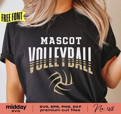 a woman wearing a black shirt with the words mascott volleyball on it and gold lettering