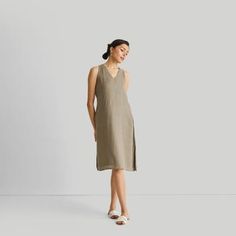 Introducing our ' V-Neck Straight Dress' - an epitome of effortless elegance and minimalist chic. This midi-dress embodies modern sophistication with its clean lines and contemporary cut, embracing the essence of simplicity. Designed for versatility, it's a summer essential, perfect for various occasions. Its A-line fit offers comfort and style, while the V-neck and in-cut sleeves add a touch of allure. This stylish dress is complemented by functional pockets on both sides for practicality. Wash Modern V-neck Dresses For Daywear, Elegant Linen V-neck Dress, Unlined Linen V-neck Midi Dress, Modern V-neck Summer Dress, Elegant V-neck Unlined Midi Dress, Modern V-neck Midi Dress For Spring, Elegant Unlined V-neck Midi Dress, Elegant Linen V-neck Midi Dress, Chic V-neck Linen Dress For Daywear