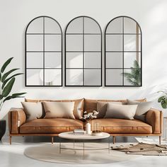 a living room with three mirrors on the wall and two couches in front of it