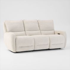 the reclining sofa has four seats and is made out of white fabric with black piping