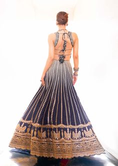 Editor's Note Captivate in the allure of heritage embroidery with this stunning lehenga, adorned in exquisite marodi and gota work, showcases vertical floral lines converging at the waist for a... Gopi Vaid, Gota Embroidery, Cancan Lehenga, Lehenga Pattern, Black Lehenga, Work Lehenga, Gota Work, Backless Blouse, Lehenga Blouse