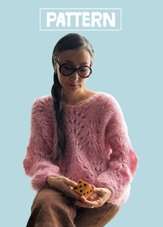 a girl wearing glasses holding a dice in her hands with the words pattern on it