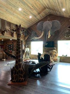 an animal themed living room with giraffes and elephants