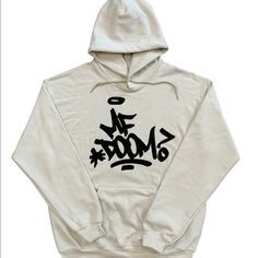 This Is The Mf Doom Hoodie With Mf Doom Graffiti On The Front And Big Madvilliany Mask On The Back On A Sand Colored Hoodie With Black Designs. Mf Doom Graffiti, Doom Graffiti, Black Designs, Teen Swag Outfits, Mf Doom, Shirt Design Inspiration, Sand Color, Swag Outfits, Black Design