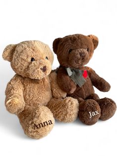 two brown teddy bears sitting next to each other on a white background with the name ajax