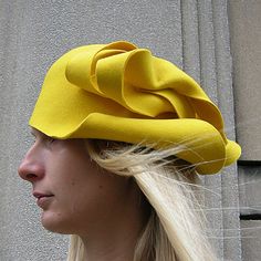 High quality felt hat made from 100% natural wool fabric.  An asymmetric pattern in colors and design according to preference.  Appropriate for casualwear, weddings, parties, or funeral.  It can be worn as you please:  sideways or backward. Spring Fitted Wool Felt Hat, Spring Wool Felt Hat, Chic Fitted Wool Hat, Spring Wool Felt Hat With Curved Brim, Fitted Wool Cloche Hat, Modern Fitted Hats For Spring, Spring Fitted Fur Felt Hats, Elegant Felt Hat For Winter, Wool Cloche Hat With Curved Brim For Spring