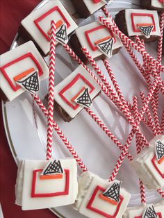 red and white striped paper straws are on a plate with brownies in the background