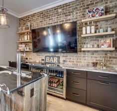 a bar with brick walls and shelves filled with bottles, glasses, and other items