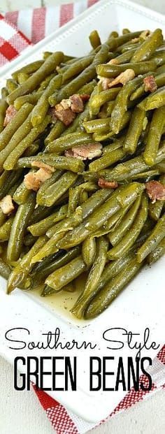 southern style green beans on a white plate with red and white checkered tablecloth