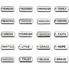 a set of different metal buttons with words on them