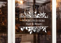 there is a sign that says your logo here hair and beauty on the glass door