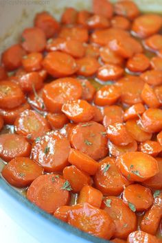 cooked carrots with herbs in a pot