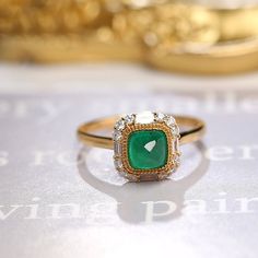 *Condition: Brand new *Center Stone: Natura Emerald from Zambia, approx 0.68ct, 6x6mm (IF clarity, 5A color) *Side Stone: Natural White Diamond, Round Cut & Baguette Cut (VS1 clarity and F color) *Gold Weight: 3.41g (depand the ring size) *Ring Dimension: approx 10x10x8.5mm *Metal Purity: Can be select Each piece is made-to-order with care and special attention to detail. all items are made with conflict-free diamonds and gems. Size: made to order The item will be gift wrapped and shipped. - Yellow Gold Emerald Diamond Ring With Halo Design, Fine Jewelry Yellow Gold Emerald Ring With Halo Design, Exquisite Yellow Gold Emerald Diamond Ring, Yellow Gold Emerald Ring With Halo Design, Formal Emerald Halo Ring Fine Jewelry, Heirloom Yellow Gold Emerald Ring With Halo Design, Luxury Gold Emerald Ring With Halo Design, Luxury 14k Gold Emerald Ring With Halo Setting, Elegant Emerald Ring With Halo Diamond Design