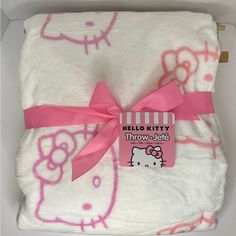 the hello kitty blanket is wrapped in pink and white