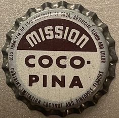 a close up of a bottle cap with the word, mission cocoa pina on it